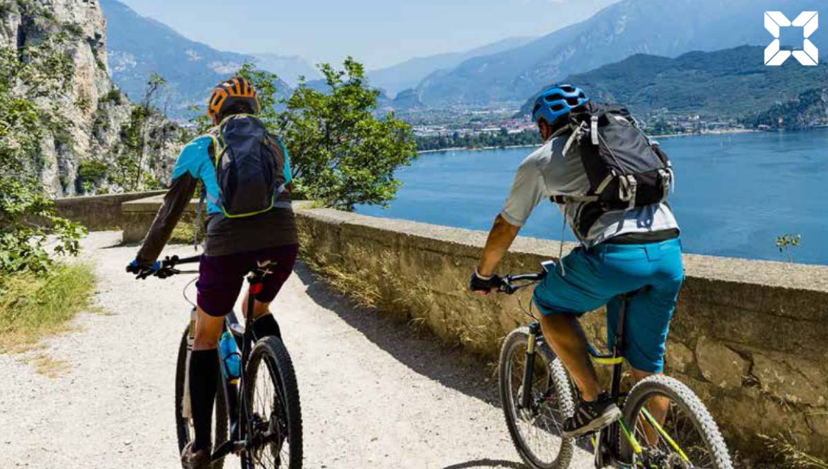 Couple cycle overlooking scenic views