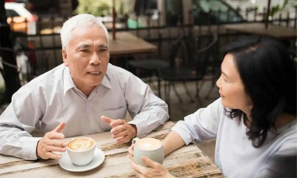 Couple discussing over a cup of coffee