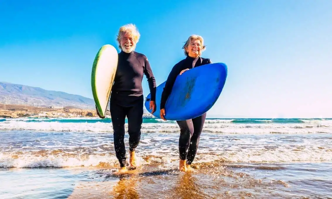 Older couple surfing