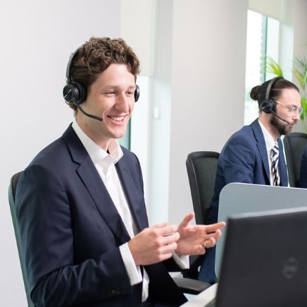 Business man on pc with headset